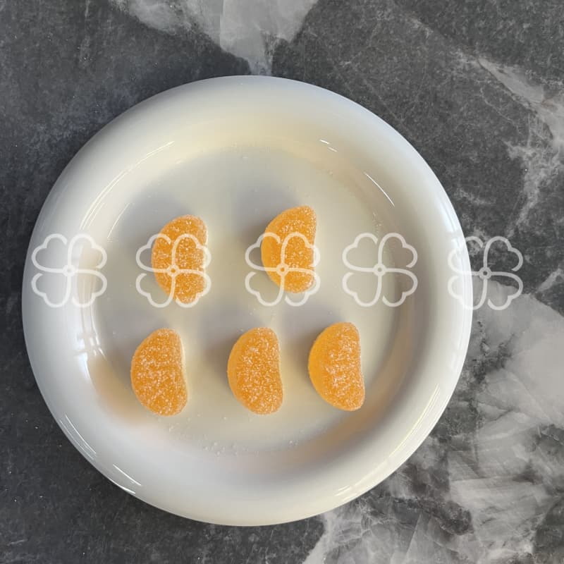 A little of the “juicy” orange gummy candy reveals delicious taste!